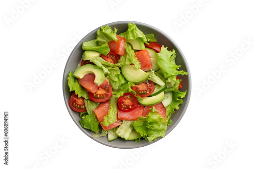Vegetable salad with tomatoes, avocado and cucumber on a white isolated background
