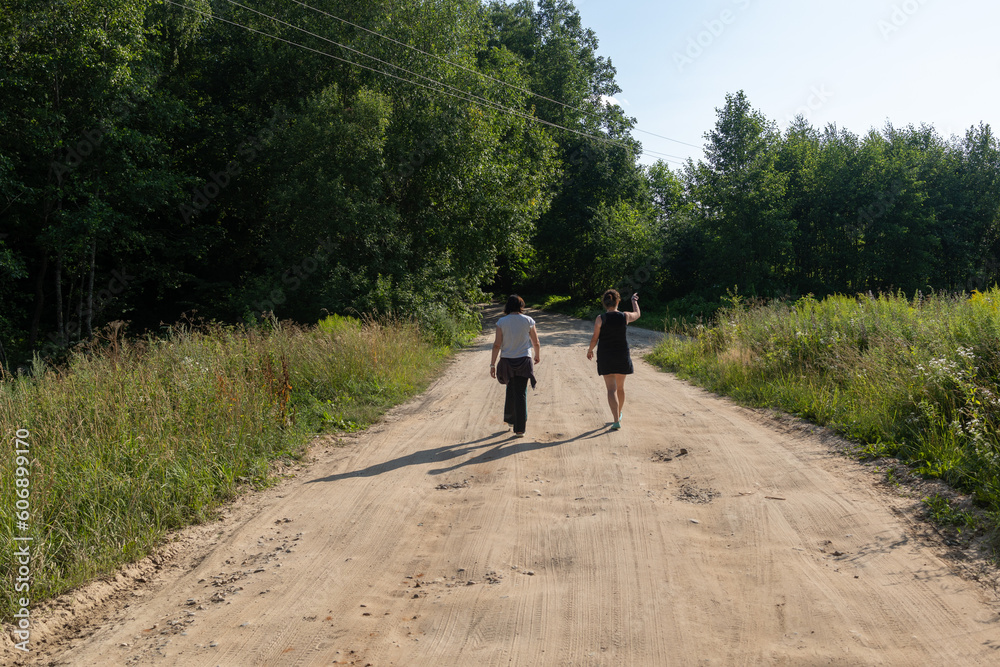 Obraz premium Beautiful rural road in the countryside, day landscape