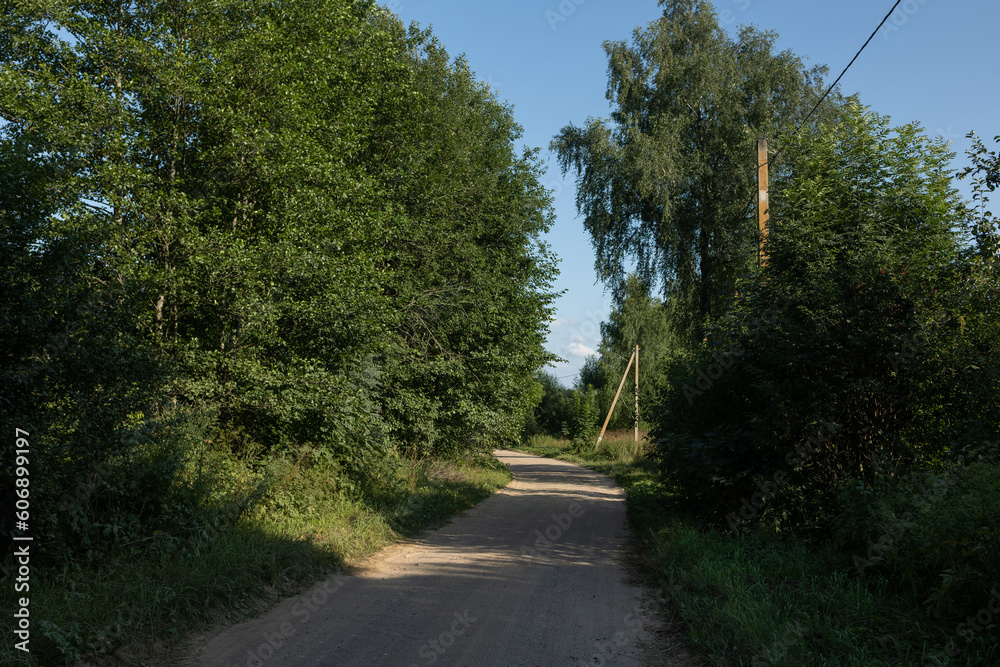 Beautiful rural road in the countryside, day landscape Beautiful rural road in the countryside, day landscape
