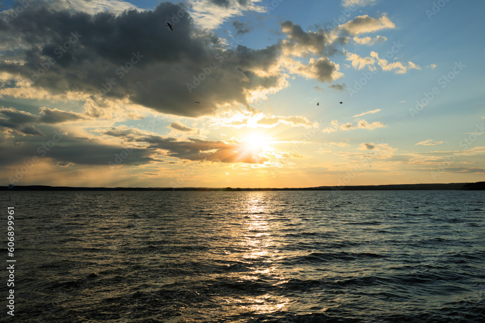 Evening landscape, sunrise or sunset on the lake or the sea Evening landscape, sunrise or sunset on the lake or the sea