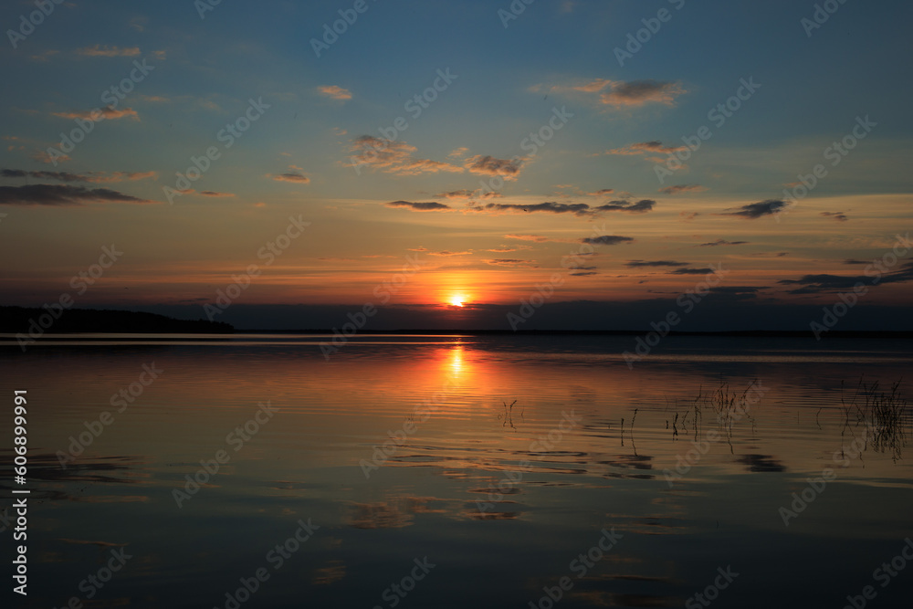 Evening landscape, sunrise or sunset on the lake or the sea Evening landscape, sunrise or sunset on the lake or the sea
