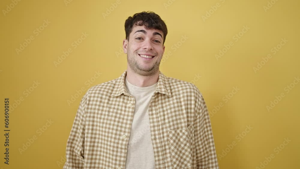 Young hispanic man saying not me laughing over isolated yellow background Young hispanic man saying not me laughing over isolated yellow background