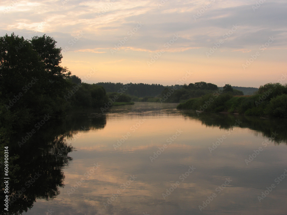 Evening landscape, sunrise or sunset on the lake or the sea