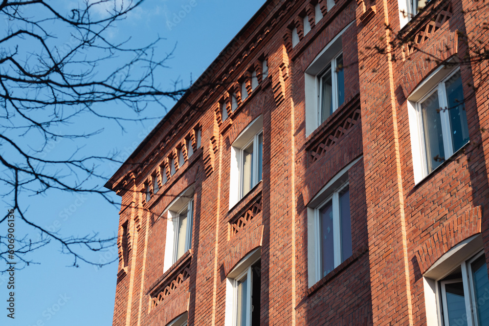 Modern apartment building for residential living in red brick stone Modern apartment building for residential living in red brick stone