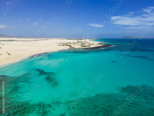 Beautiful high aspect aerial panoramic view of the white sandy beach of Playa del Dormidero near Corralejo in Fuerteventura Canary Islands Spain © Dave