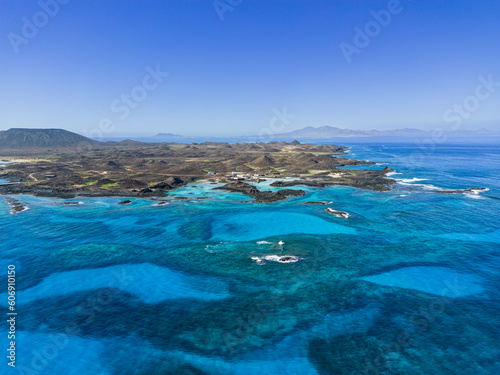 Aerial view of Puertito village and the beautiful natural pools  lagoons of the island of Lobos near Corralejo in Fuerteventura Spain © Dave