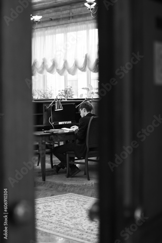 a boy with a book in the library