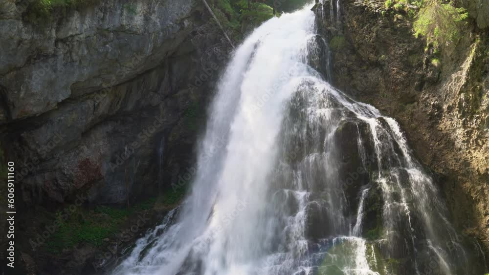 Waterfall cascade over mossy mountain rocks in the Alps. Gollinger Waterfall in Golling an der Salzach near Salzburg, Austria. Stunning view of wild nature. long exposure shot with slow shutter speed. Waterfall cascade over mossy mountain rocks in the Alps. Gollinger Waterfall in Golling an der Salzach near Salzburg, Austria. Stunning view of wild nature. long exposure shot with slow shutter speed.
