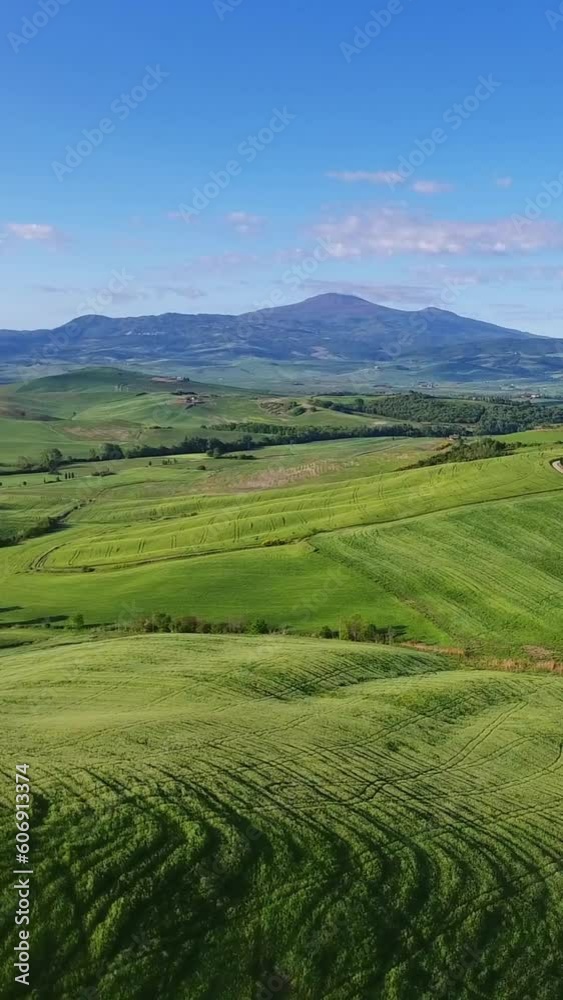 Tuscany aerial landscape of farmland hill country at evening. Italy, Europe. Vertical video Tuscany aerial landscape of farmland hill country at evening. Italy, Europe. Vertical video