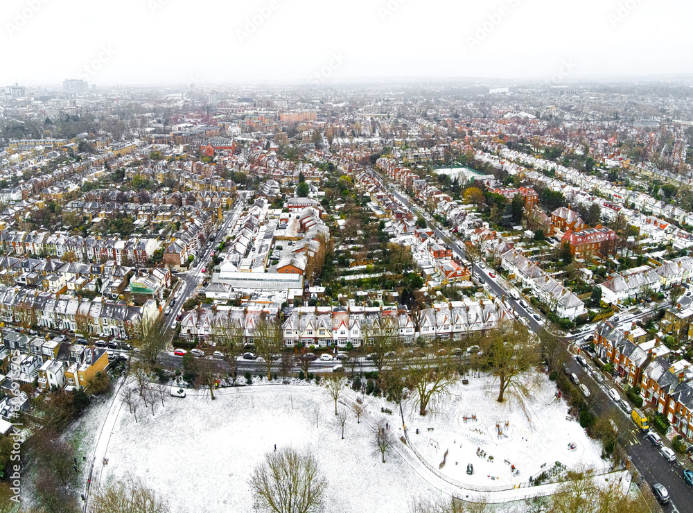 Aerial view of snowy London suburb in winter