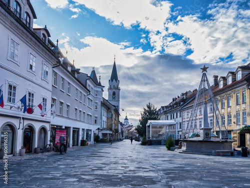 Kranj village tiled street, historic buildings and clock tower at the square, Slovenia
