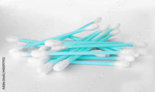 Heap of clean cotton buds on white background