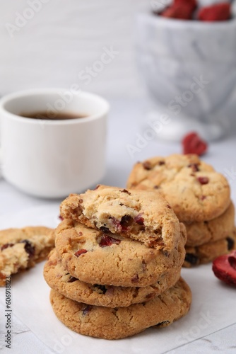 Cookies with freeze dried fruits and nuts on white marble table  closeup