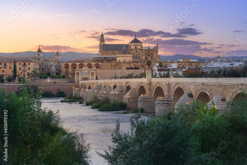 Cordoba Skyline at sunset with Cathedral, Roman Bridge and Guadalquivir River - Cordoba, Andalusia, Spain photo