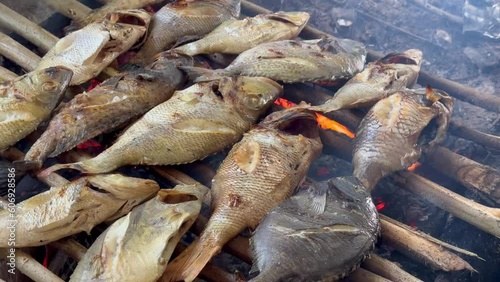 Grilling fish on Karimun Jawa beach photo