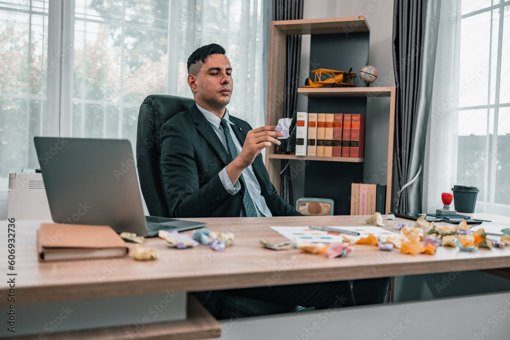 After having difficulties with the project's actual implementation, the CEO feels stress and concern, causing him to angrily crumple some sticky notes, which contained a number of different ideas. After having difficulties with the project's actual implementation, the CEO feels stress and concern, causing him to angrily crumple some sticky notes, which contained a number of different ideas.