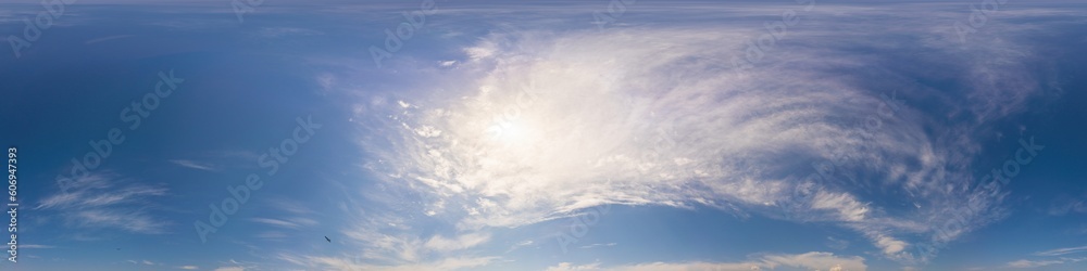 Obraz premium Blue summer 360 panorama of sky with clouds, no ground, in spherical equirectangular format for easy use in 3D graphics and aerial or ground composites, seamless and suitable for sky replacement.