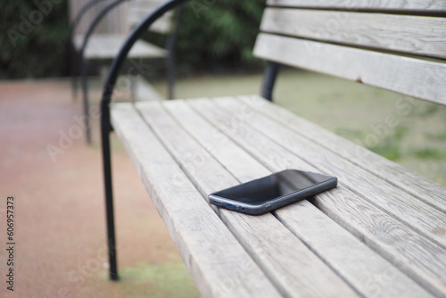 forget smartphone on a park bench, lost smart phone  photo