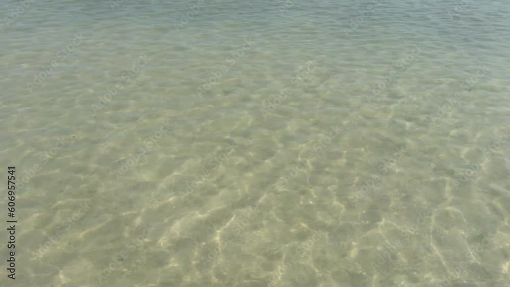 Shallow Water Surface on White Beach With Sunlight Reflection Shallow Water Surface on White Beach With Sunlight Reflection