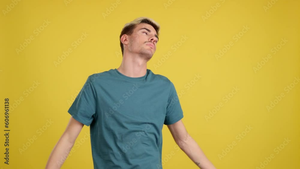 Bored gay man standing and looking up Bored gay man standing and looking up