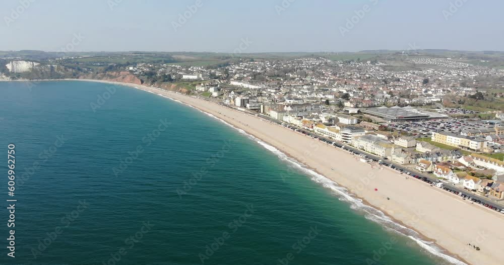 Aerial View Of Seaton Beach And Esplanade In Devon. Slow Dolly Descending Shot Aerial View Of Seaton Beach And Esplanade In Devon. Slow Dolly Descending Shot