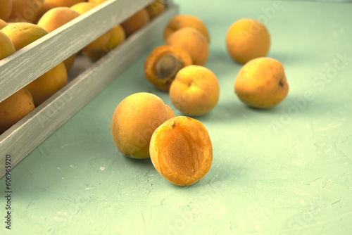 ripe juicy apricots in a wooden box and on burlap