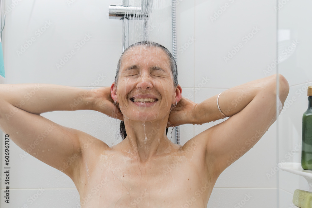 Portrait of woman applying shampoo on her hair. Hair wash. Lifestyle portrait. Portrait of woman applying shampoo on her hair. Hair wash. Lifestyle portrait.