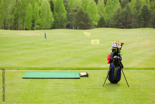 The Golf club bag for golfer training and play in game with golf course background , green tree rays. 