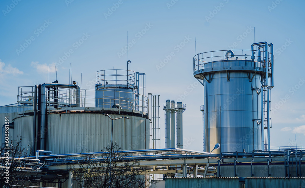 Modern silos for storing grain harvest at the blue sky background. Modern silos for storing grain harvest at the blue sky background.