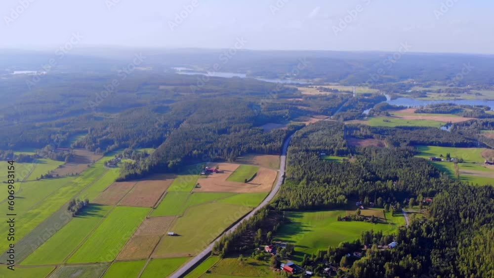 Drone shot of view from height over nature and farmers land in Sweden. Drone shot of view from height over nature and farmers land in Sweden.