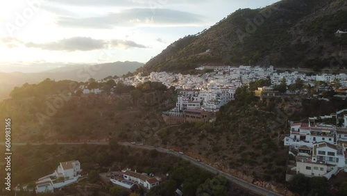 Golden sunset above township of Mijas in Spain, aerial drone view