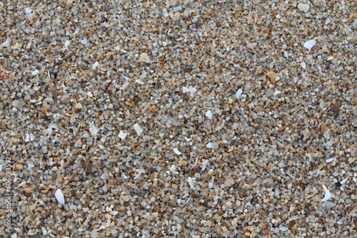 Sand gravel texture on the beach for background. Top view.
