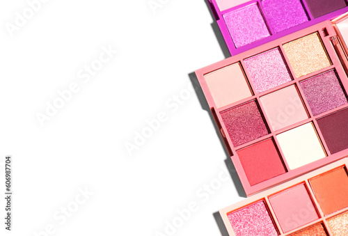 Makeup palette set isolated on white background. Professional multicolor eyeshadow palette. Makeup. Professional multicolor eye shadow make-up palette, close-up. Various Colorful bright eye shadows.  photo