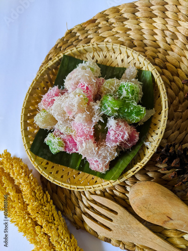 Cenil is a typical Javanese food made from cassava starch and colored and sprinkled with grated coconut. This food has a chewy texture and sweet taste photo