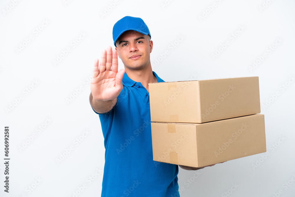 Delivery caucasian man isolated on white background making stop gesture Delivery caucasian man isolated on white background making stop gesture