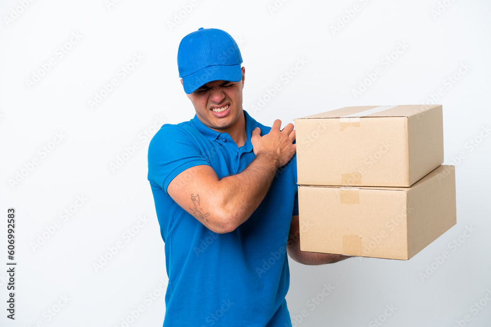 Delivery caucasian man isolated on white background suffering from pain in shoulder for having made an effort