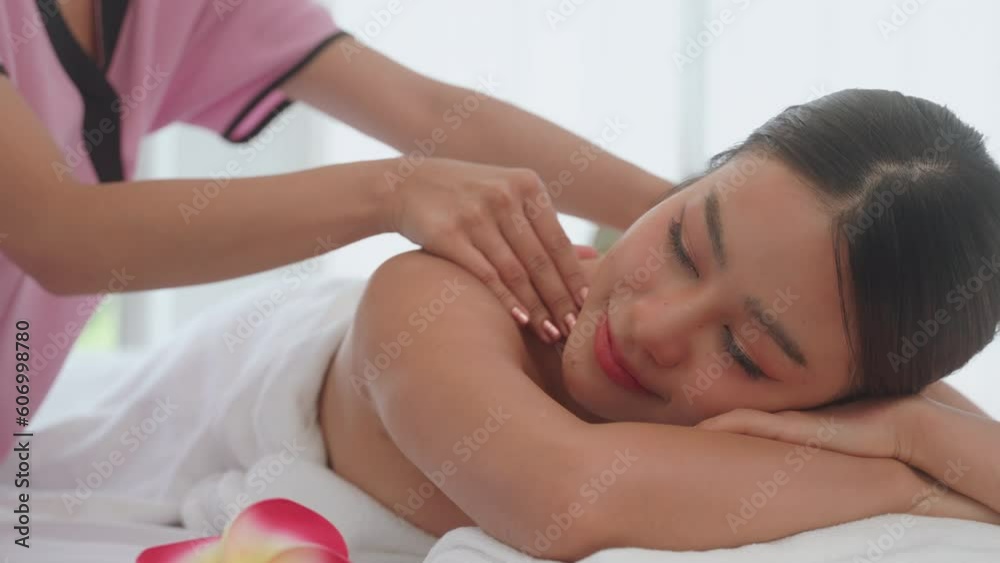 Young woman having massage in the spa salon. Spa for relaxation in modern wellness center. Young woman having massage in the spa salon. Spa for relaxation in modern wellness center.