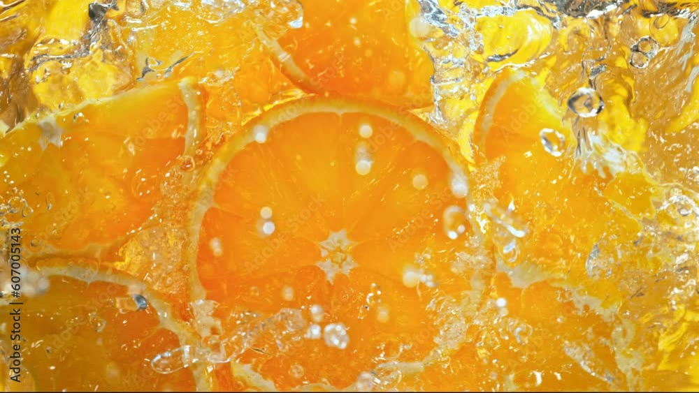 custom made wallpaper toronto digitalSuper Slow Motion Shot of Fresh Orange Slices Falling into Water Whirl at 1000 fps.