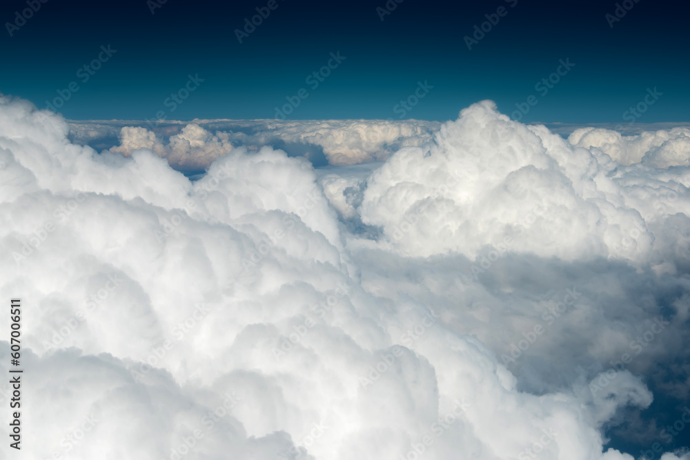 Clouds and sky as seen through window of an aircraft Clouds and sky as seen through window of an aircraft