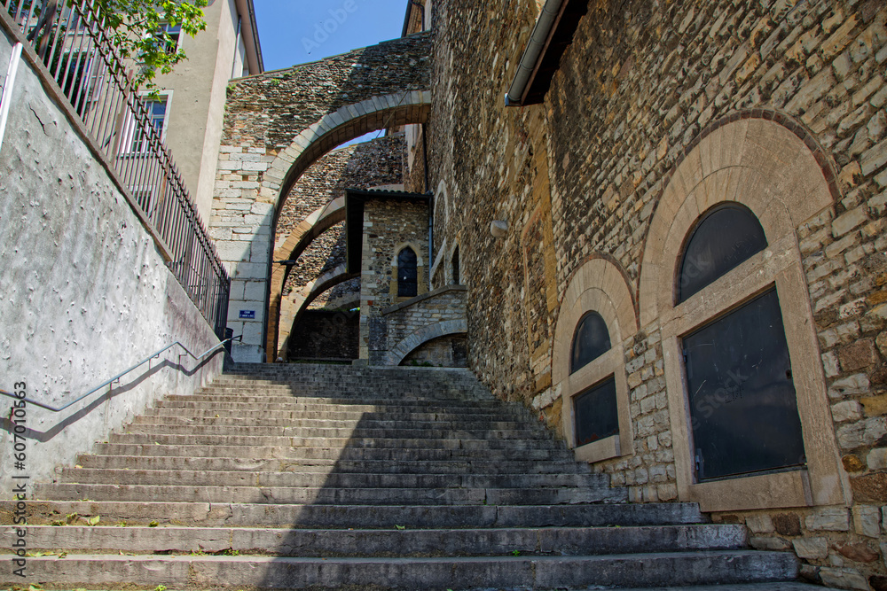 Naklejka premium VIENNE, FRANCE, May 26, 2023 : Saint-Andre-le-Bas church, founded in the 8th century by Duke Ansemond. Cloister and chapel are all remainings of the ancient abbey.