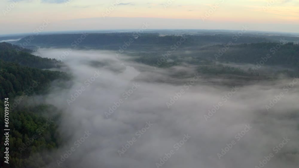 View of valley filled with fog - establishing shoot. Setting mood. View of valley filled with fog - establishing shoot. Setting mood.
