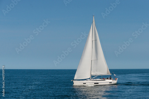 CS50 sailboat is sailing on the sea © Marek
