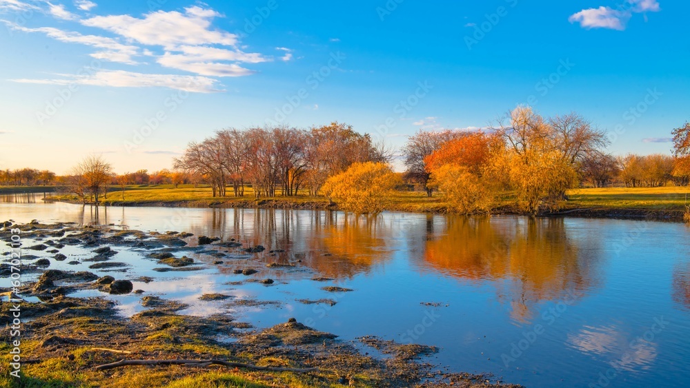 Beautiful landscape of a lake and trees in the background in autumn. Beautiful landscape of a lake and trees in the background in autumn.