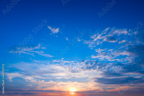 Bright sun rise against the blue sky. © alinamd