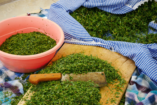 chopping madimak grass with rows, making a delicious madimak meal, madimak plant, photo