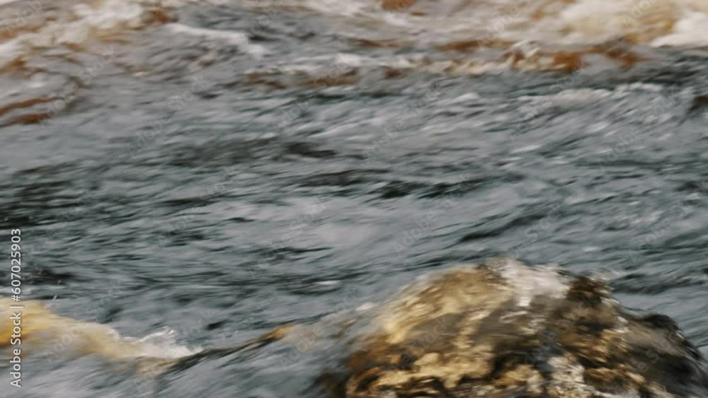 Flowing stream with water splashes in Dalarna Bjorbo Fanforsen Sweden Flowing stream with water splashes in Dalarna Bjorbo Fanforsen Sweden