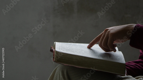 Bible concept.Man reading bible and praying to god before work. believe in goodness.Prayer on a wooden table.Concept for faith.copy space.