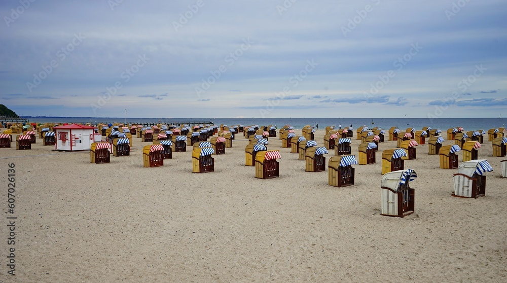 Beautiful shot of baskets in the Travemunde Strand beach on a cloudy day