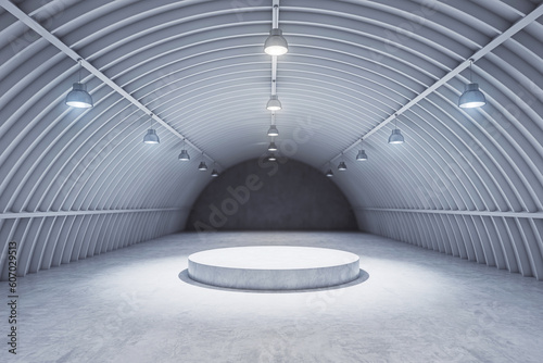 Front view grey hangar interior with spotlight and round pedestal on concrete floor, product presentation background and empty stage concept. 3D Rendering, mockup