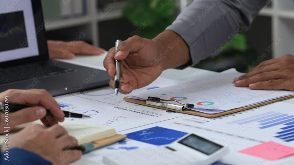 Finance workers are working together to prepare company financial documents for the meeting with management, together they are checking the accuracy of the information. Financial concept. Finance workers are working together to prepare company financial documents for the meeting with management, together they are checking the accuracy of the information. Financial concept.